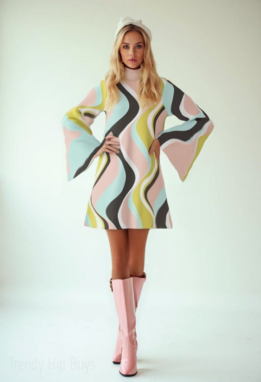 Woman wearing a colorful retro 70s dress with wavy pattern and pink knee-high boots on a white background