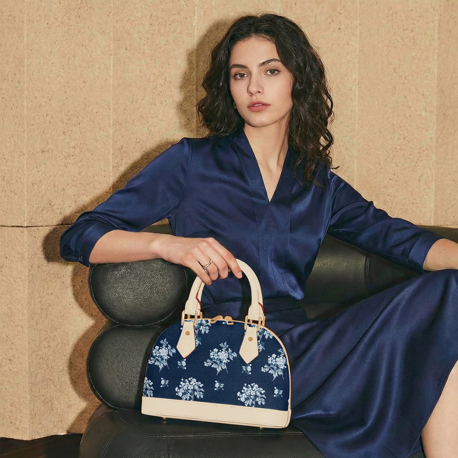 Romantic navy blue floral half moon handbag with delicate vintage-inspired floral print. Small crossbody purse with black or beige handles for casual or formal wear.